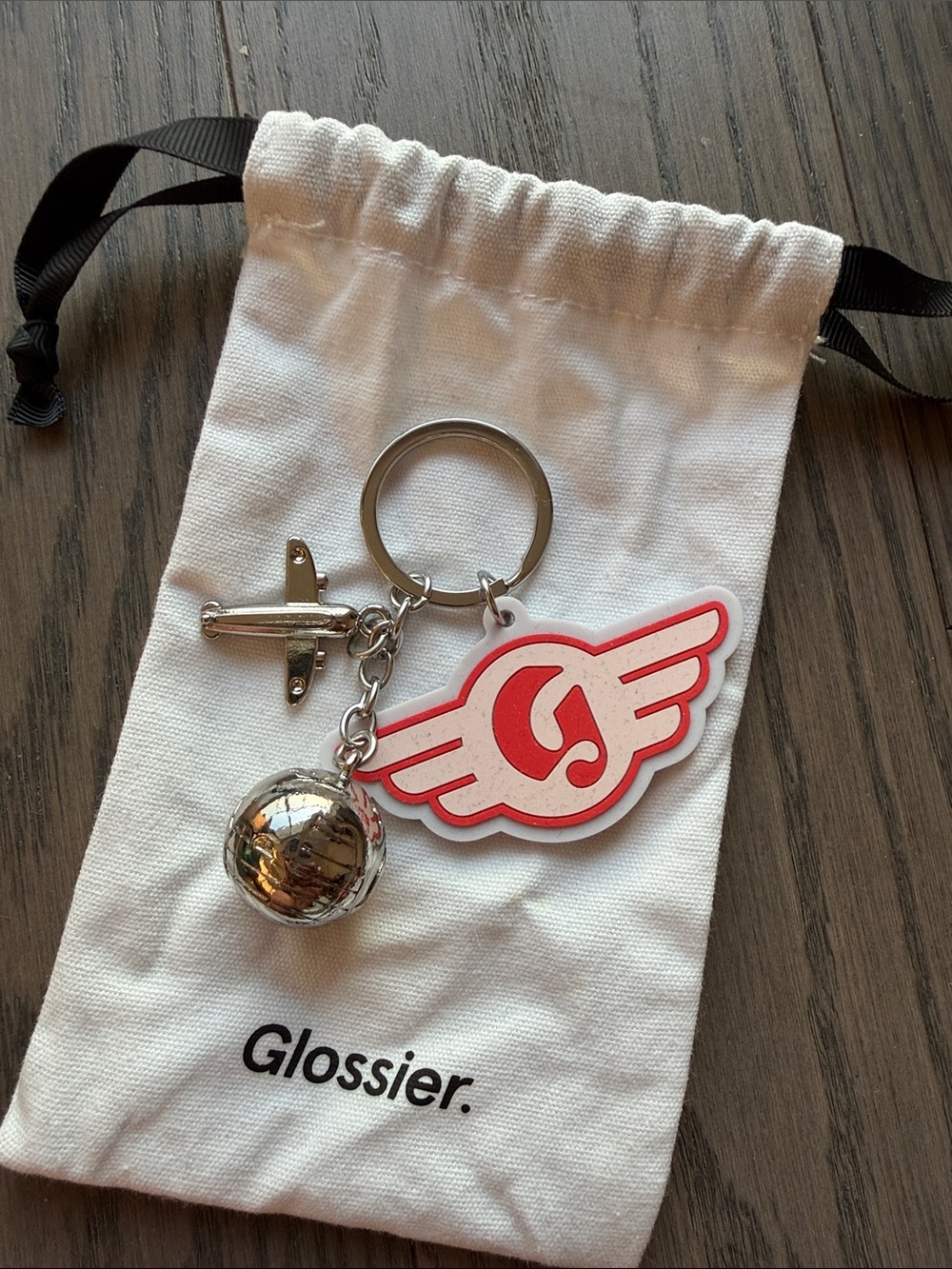 Glossier Keychain with Red & White Winged Logo and Silver Charms